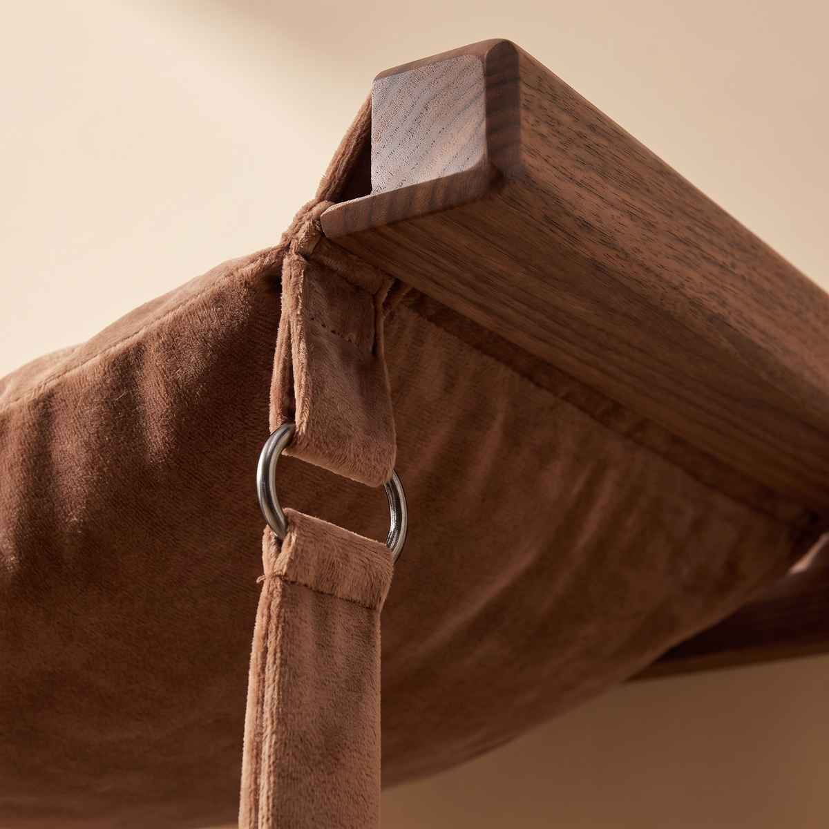 Close detail of the wooden frame joining the suspended hammock