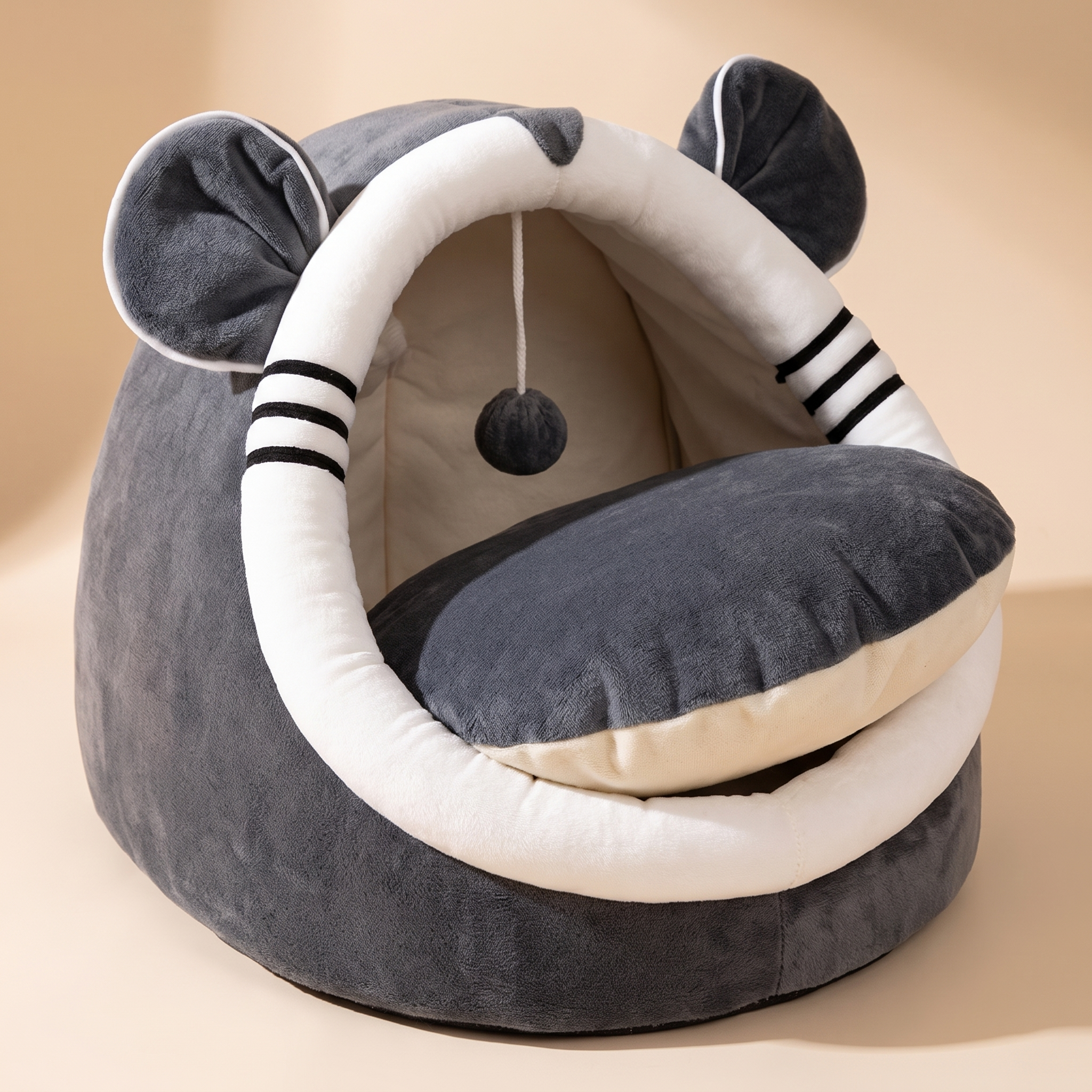 Close detail of the cat nest cushion lifted to show the washable inner