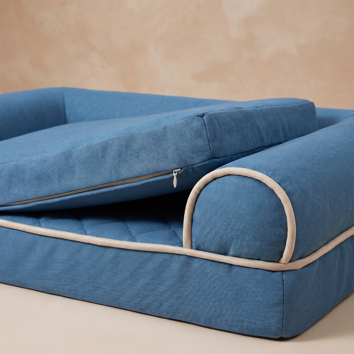 Close detail of the bolster edge and removable cover of the pet bed