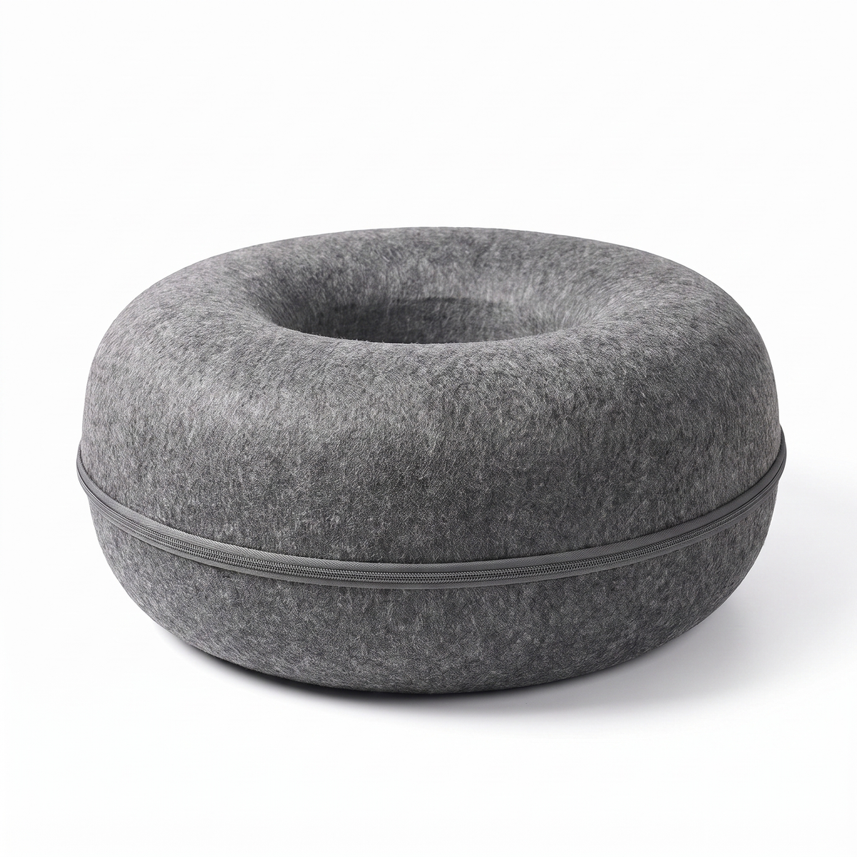 Felt donut cat bed on a white studio background