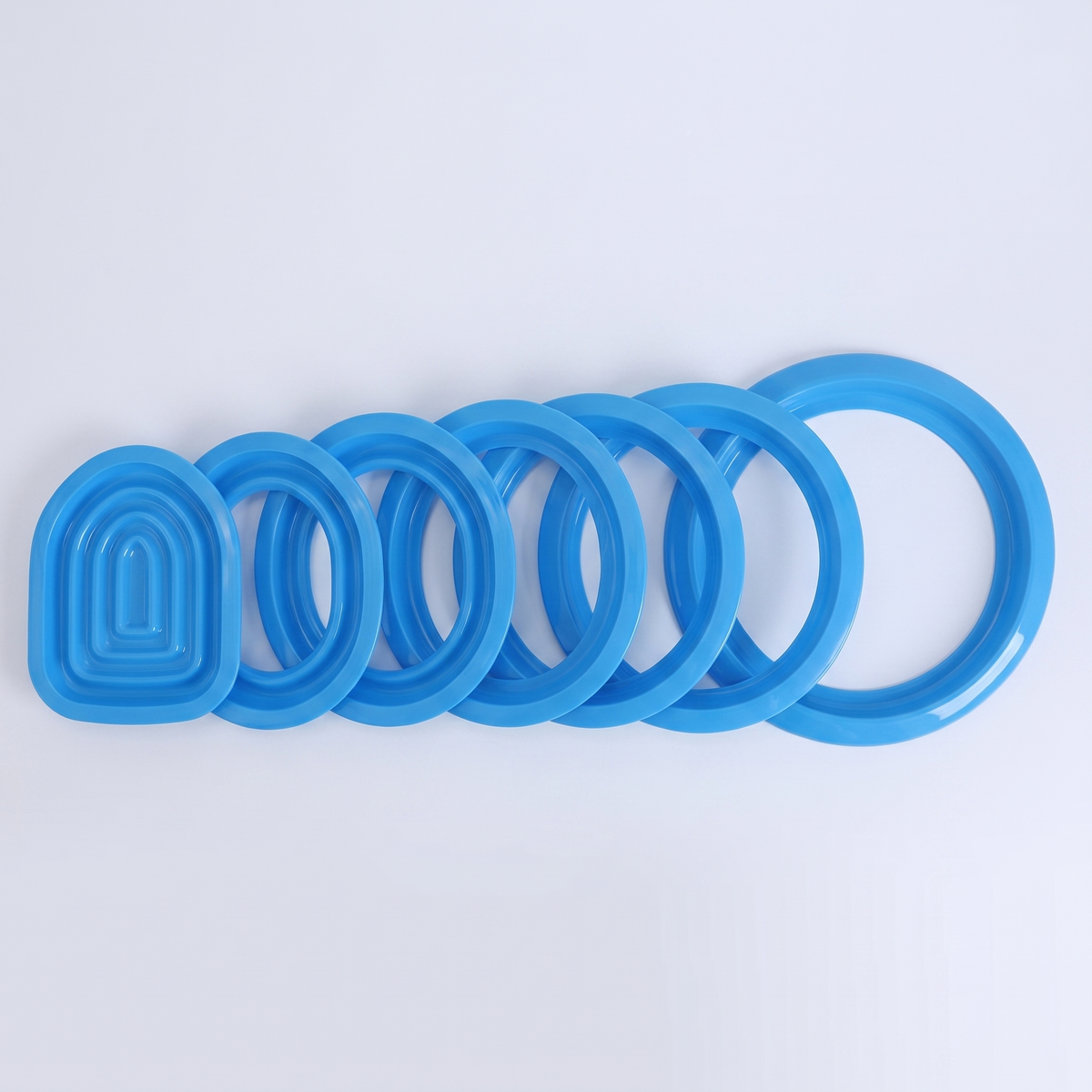 The nested training rings laid out in a row showing the training stages