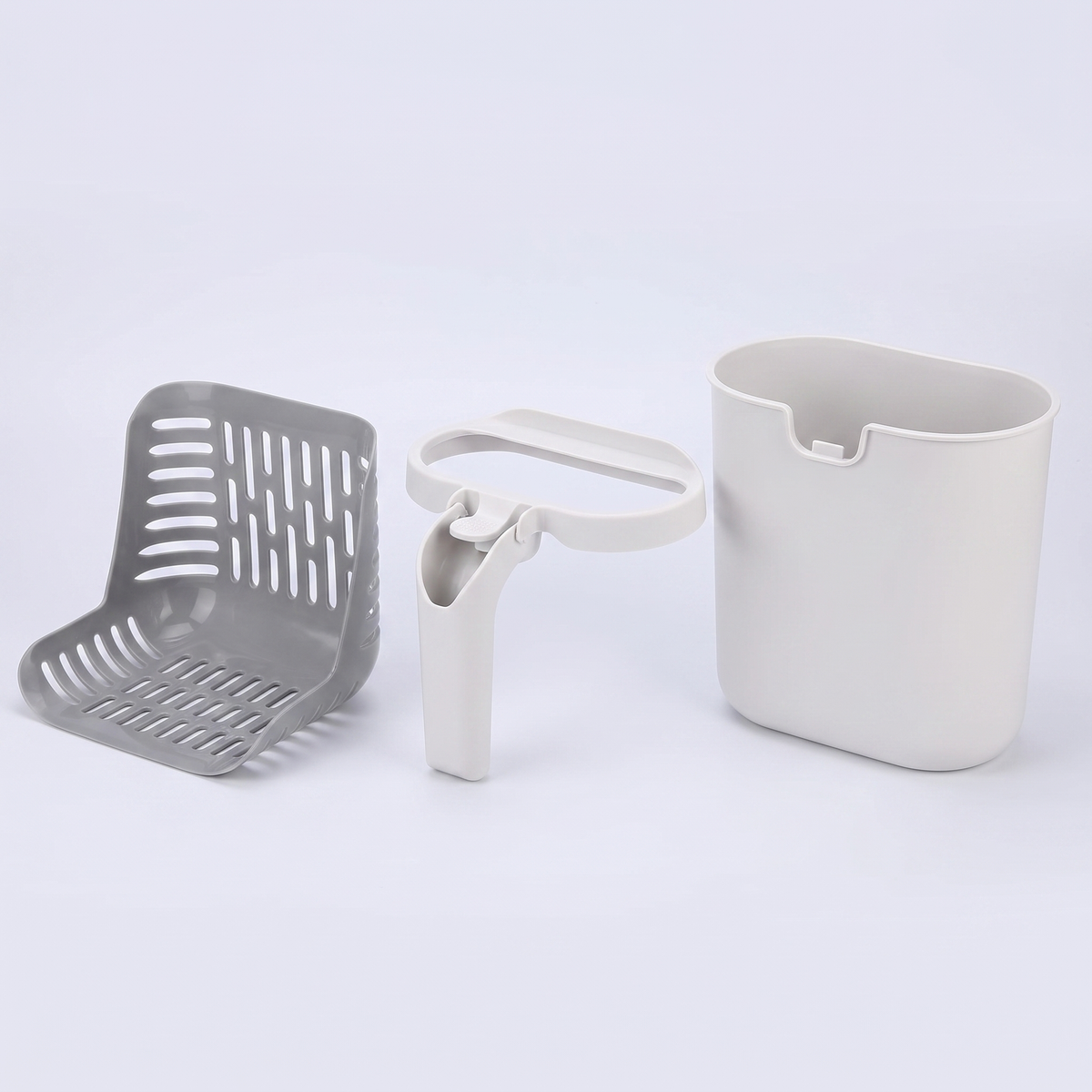 The scoop and holder disassembled into separate parts for washing