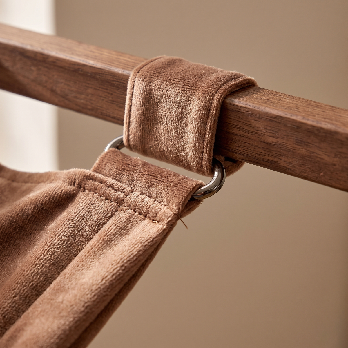 Close view of the hammock fabric where it attaches to the wooden frame