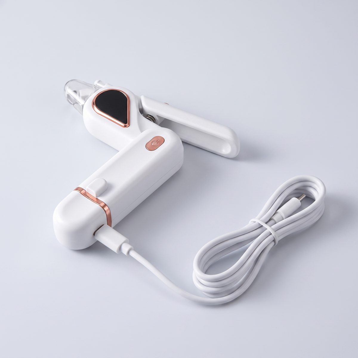 The clipper beside its Type-C charging cable plugged in