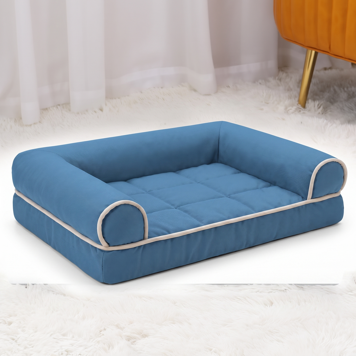 Square bolstered pet bed on a white studio background