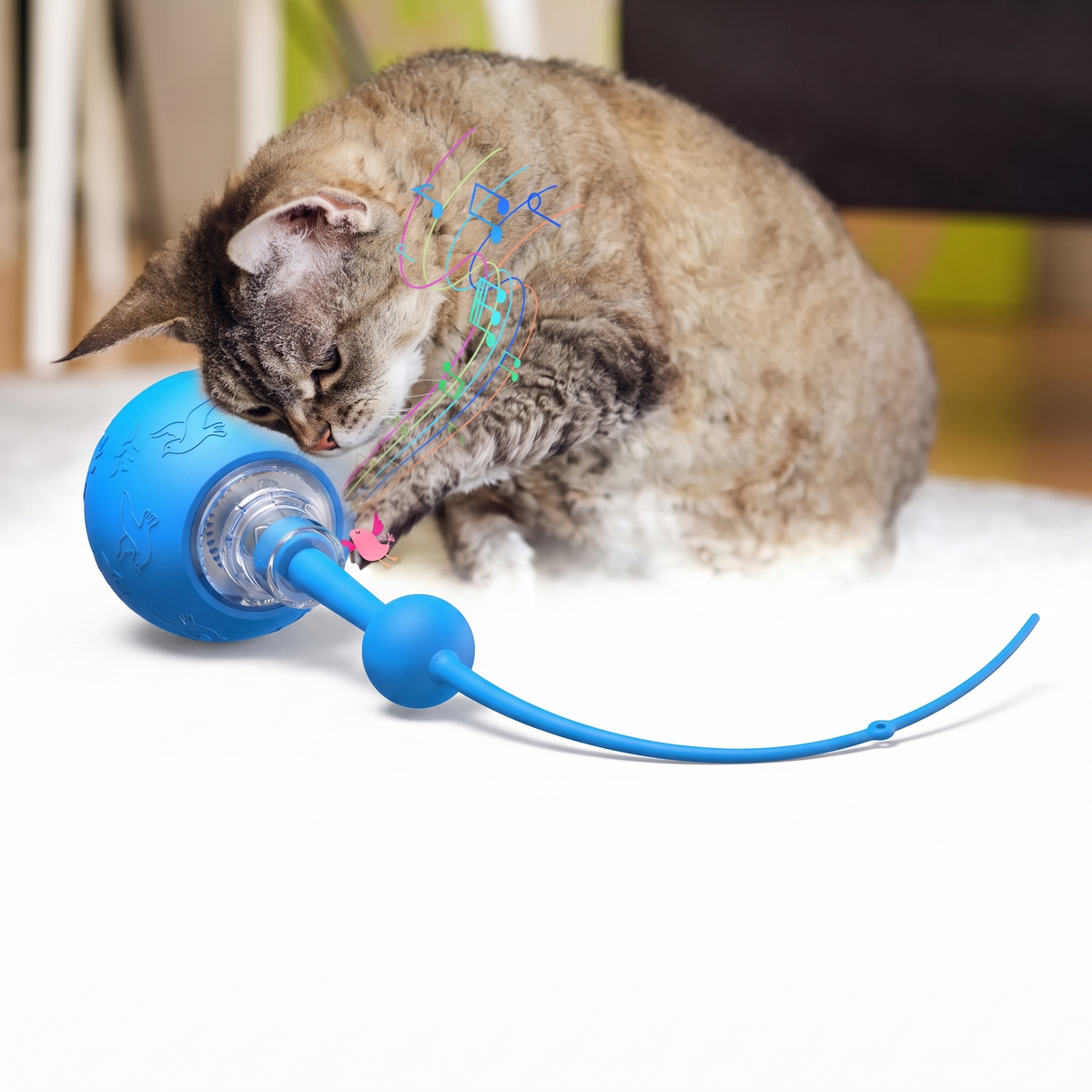 Smart electric cat toy ball with silicone tail on a white studio background