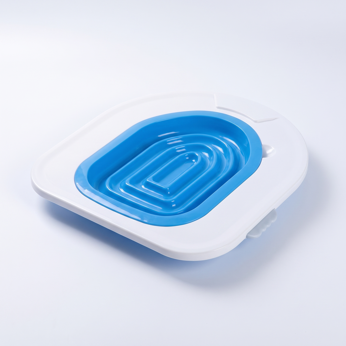 Cat toilet training tray on a white studio background